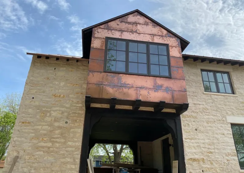 Copper metal panel facade on a stone building for Metal Roof Coating in Hidalgo